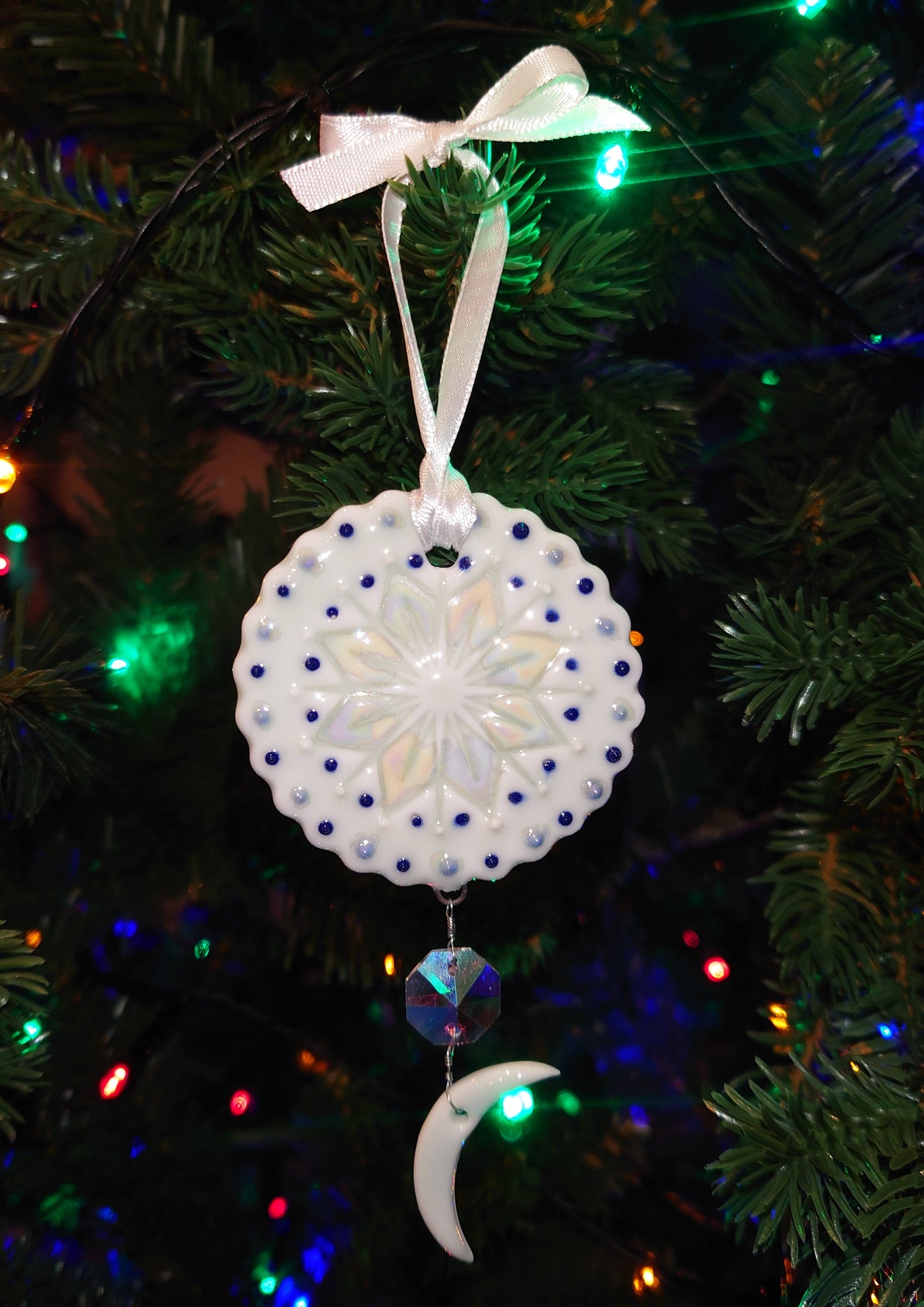 Porcelain Decoration with Mother of Pearl Lustre and Dangling Charm