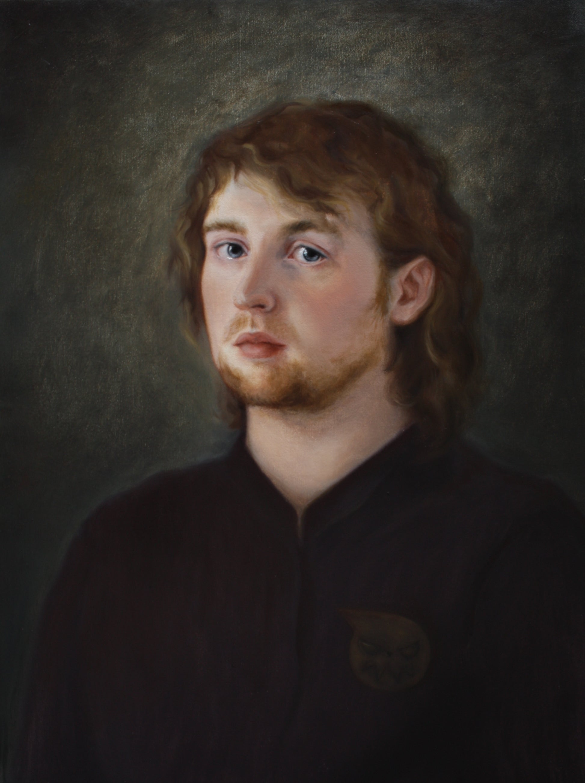Oil painting of a young white man with golden curly hair and beard. He is wearing a purple collarless shirt and making eye contact with the viewer.
